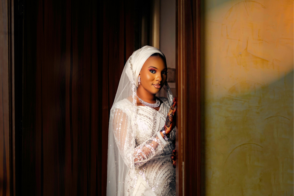 Bride in doorway with wedding budget snapshot